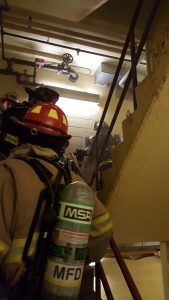 Firefighters Going up Concrete Stairs