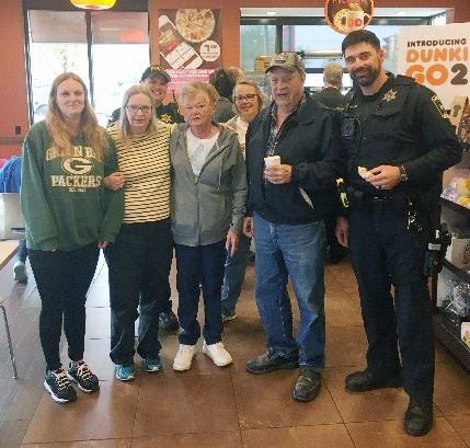 Group at Coffee Shop with Police Officer