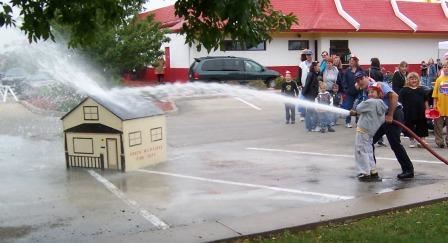 Small Kid with a Water Hose